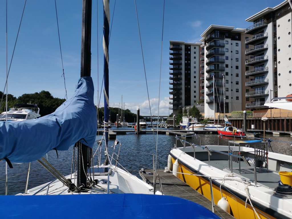 The view from a white sailing yacht overlooking Cardiff Marina.