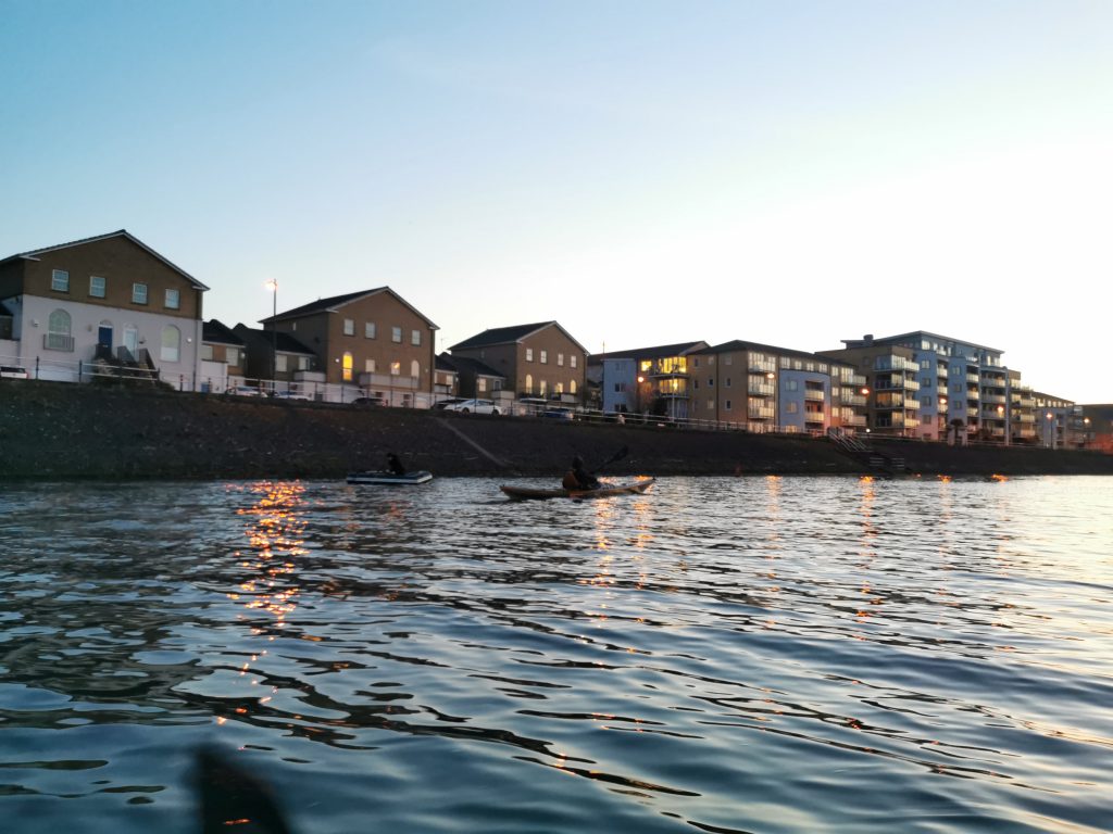 A row of houses mark the route up-river to Cardiff Marina from the lock.