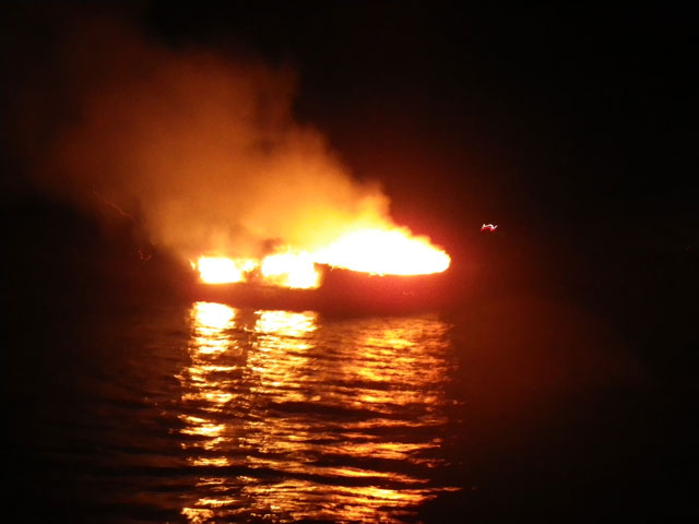 Poole RNLI douses burning boat