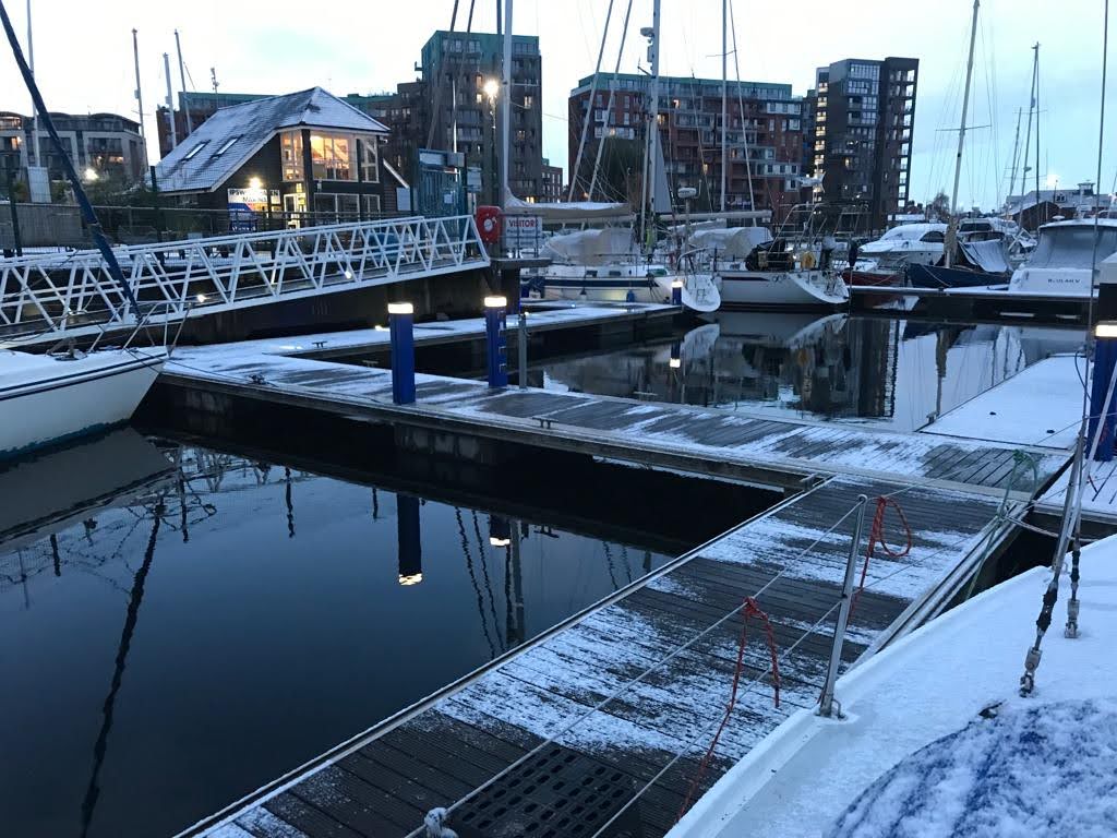 A frosty and snow-covered Ipswich Marina at dawn