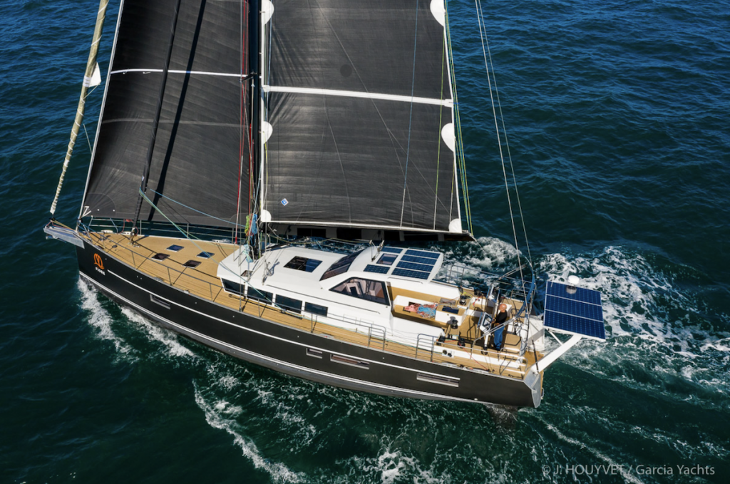 The Exploration 60 with black sails, sailing on the open sea