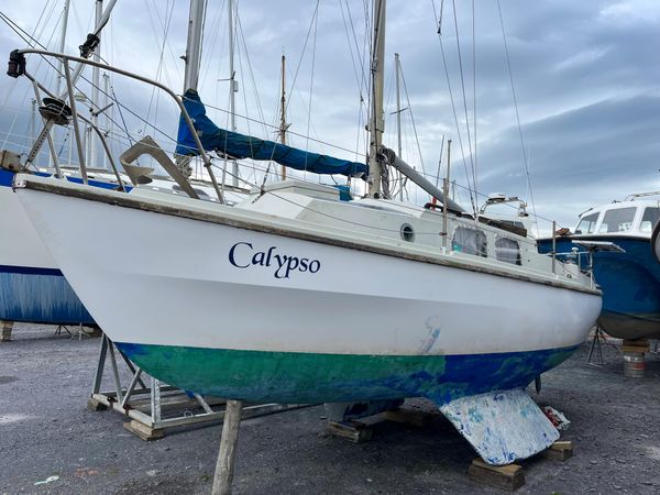 A Westerly Centaur sailing boat named Calypso sits in the docks