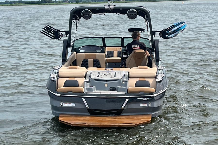 A MasterCraft X22 watersport boat at sea