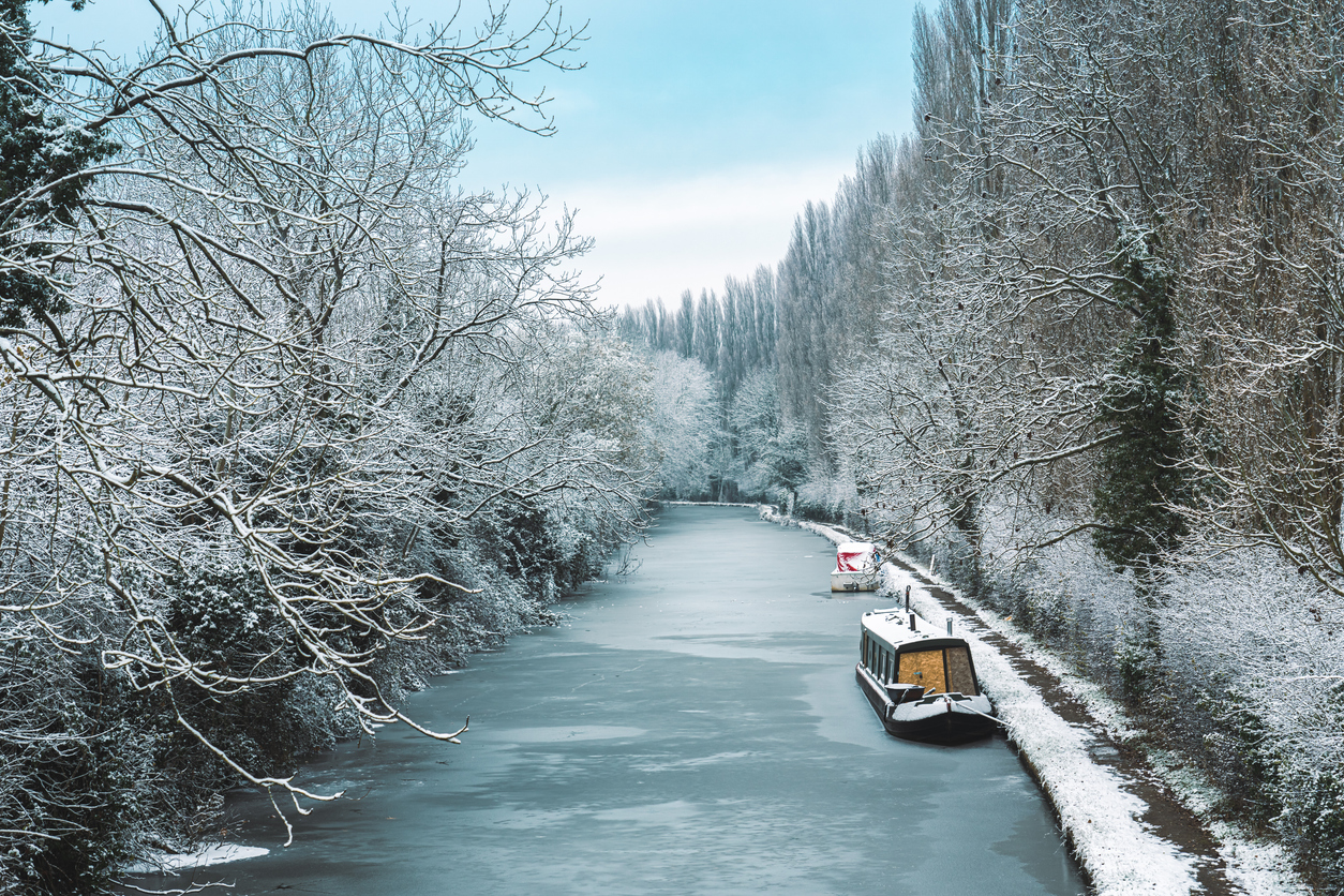 A canal boat moored in snowy Bridgewater, England.