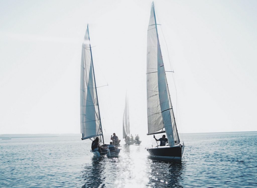 three sailing boats on the water